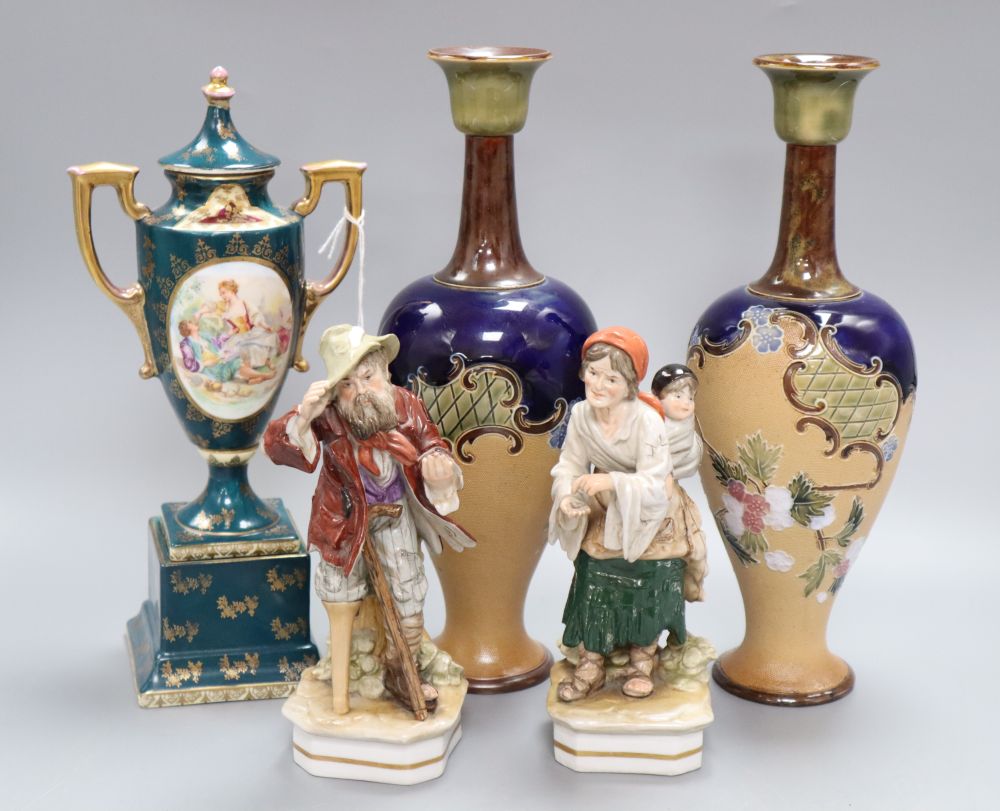 A pair of Doulton Slaters patent stoneware vases, Continental figures and a Vienna style urn and cover, tallest 28cm